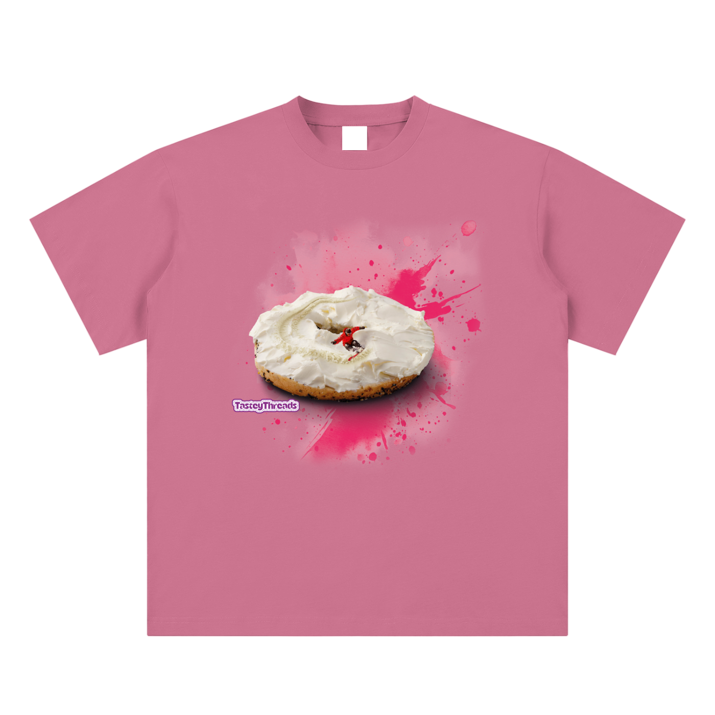 Tastey Threads Backcountry Bagel design, on a puff pink super soft suaded cotton t-shirt, the cream cheese on a bagel doubling as snow for the snowboarder to shred on